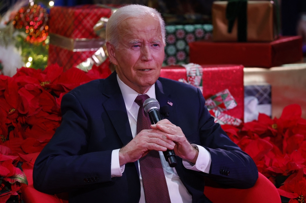 US President Joe Biden speaks during a holiday visit to patients and families at Children痴 National Hospital in Washington, DC, on December 20, 2024. (Photo by Ting Shen / AFP)