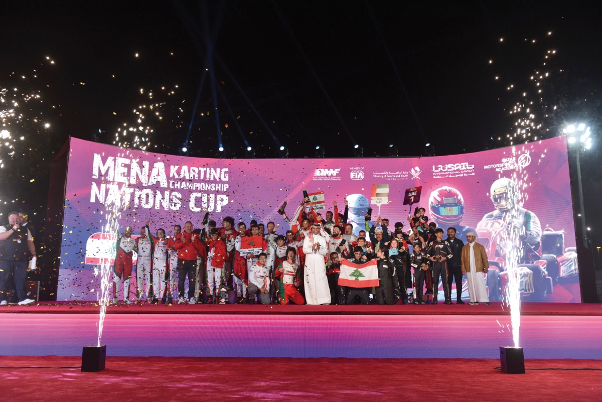 Executive Director of Qatar Motor and Motorcycle Federation (QMMF) and CEO of Lusail International Circuit (LIC) Amro Al Hamad with the top three teams of the MENA Nations Cup at the Lusail International Circuit yesterday. Lebanon won first position, Morocco were ranked second and UAE third overall.