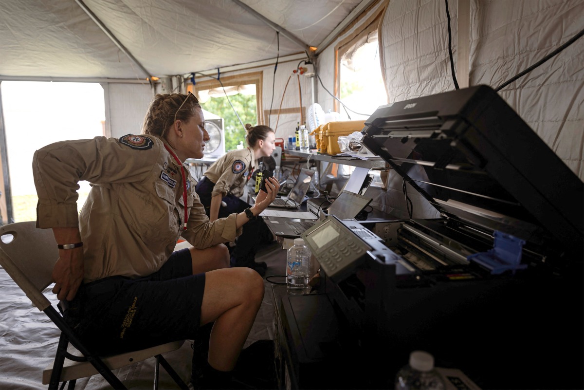 A handout photo from the Australian Department of Foreign Affairs and Trade, dated December 22, 2024, shows Australian disaster response team members operating a station to support local authorities in Port Vila after a powerful earthquake struck Vanuatu's capital on December 17. Photo by Niki Kuatonga / AUSTRALIA'S DEPARTMENT OF FOREIGN AFFAIRS AND TRADE / AFP