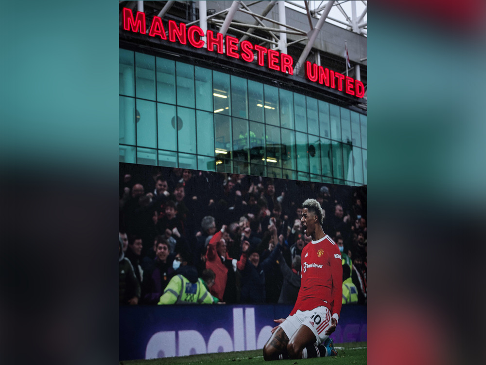 A photograph taken on December 22, 2024 shows a picture of Manchester United's English striker #10 Marcus Rashford celebrating outside Old Trafford in Manchester, north west England, on December 22, 2024 ahead of the English Premier League football match between Manchester United and Bournemouth. (Photo by Darren Staples / AFP) 