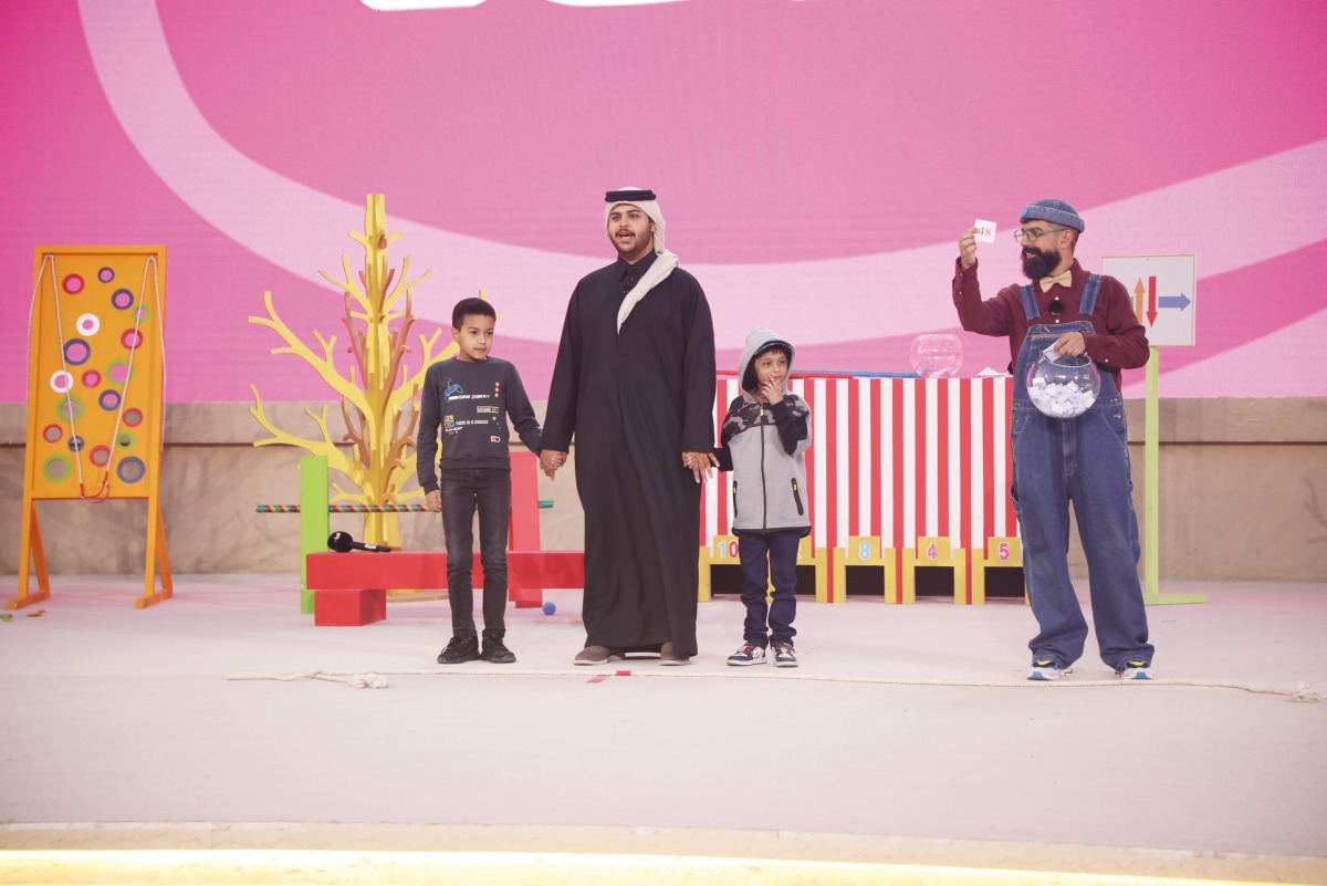 Children participate in the programme held as part of National Day activities at Dar Al Saai. 