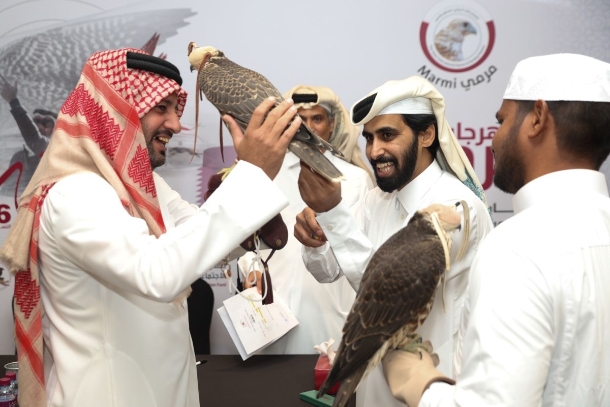 Falconers during the registration of the Qatar International Falconry and Hunting Festival (Marmi 2025) in Katara yesterday. 