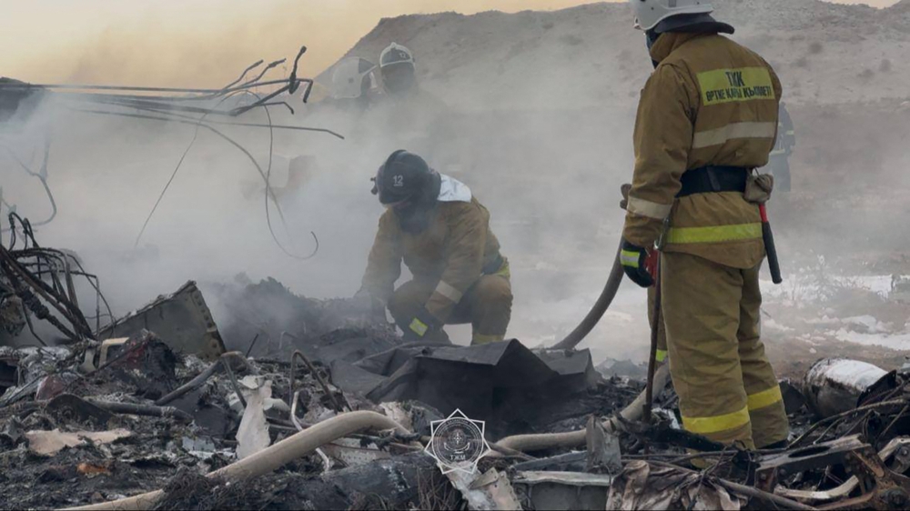 In this handout picture released by Kazakhstan's emergency situations ministry, emergency specialists work at the crash site of an Azerbaijan Airlines passenger jet near the western Kazakh city of Aktau on December 25, 2024. (Photo by Handout / Kazakhstan's emergency situations ministry / AFP) 