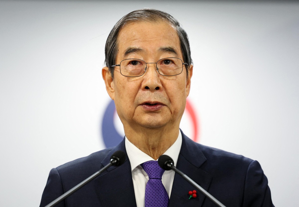 South Korea Prime Minister and acting President Han Duck-soo speaks in his address to the nation at the Government Complex in Seoul on December 26, 2024. Photo by YONHAP / AFP