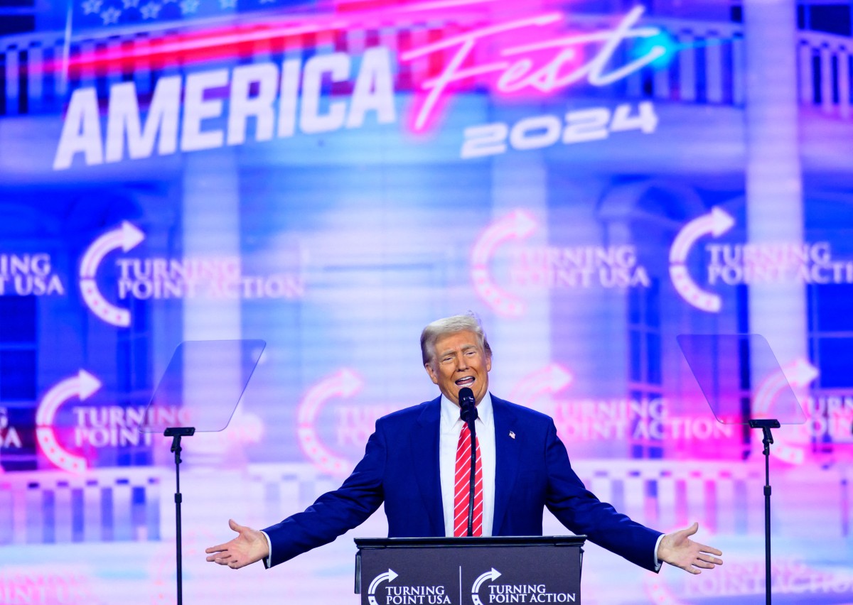 US President-elect Donald Trump speaks during Turning Point's annual AmericaFest 2024 in Phoenix, Arizona, on December 22, 2024. (Photo by JOSH EDELSON / AFP)
