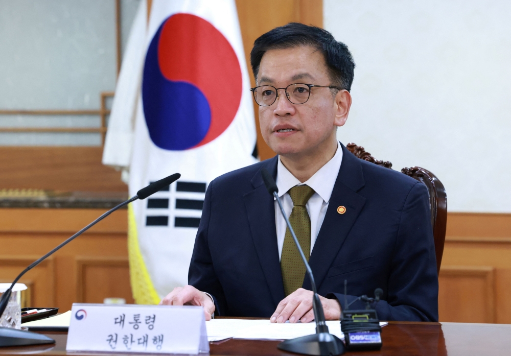 South Korea's Finance Minister and new acting president Choi Sang-mok speaks as he presides over a meeting of the National Security Council at the Government Complex in Seoul on December 27, 2024. (Photo by YONHAP / AFP) 