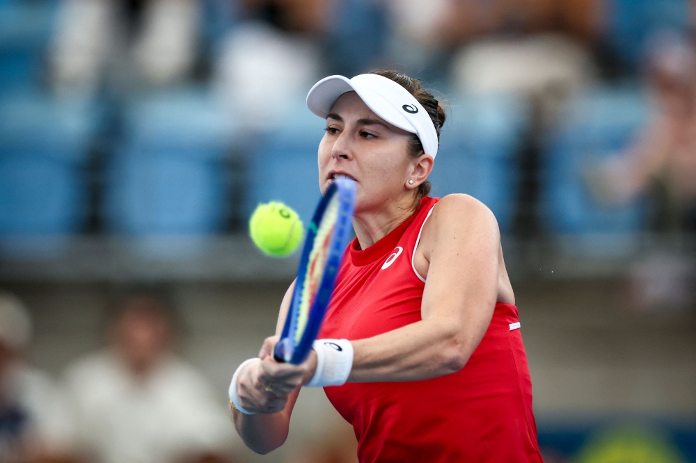 Switzerland's Belinda Bencic hits a return to France's Chloe Paquet during their women's singles match at the United Cup tennis tournament on Ken Rosewall Arena in Sydney on December 28, 2024. (Photo by David Gray / AFP) 