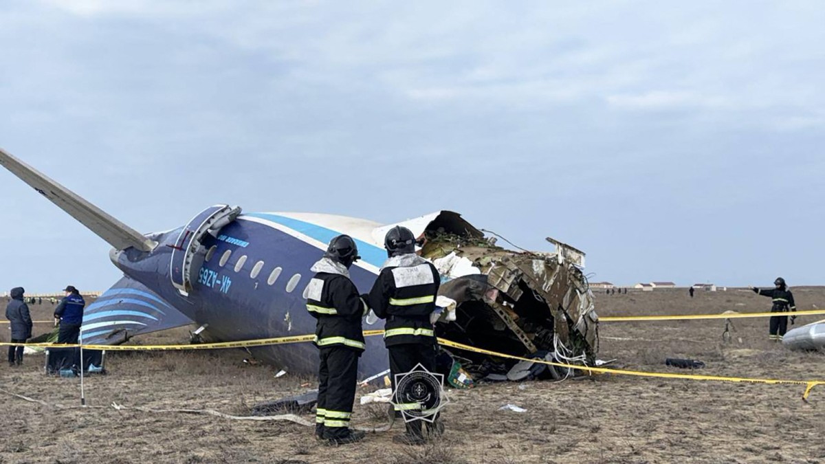 In this handout picture released by Kazakhstan's emergency situations ministry, emergency specialists work at the crash site of an Azerbaijan Airlines passenger jet near the western Kazakh city of Aktau on December 25, 2024. Photo by Handout / Kazakhstan's emergency situations ministry / AFP).