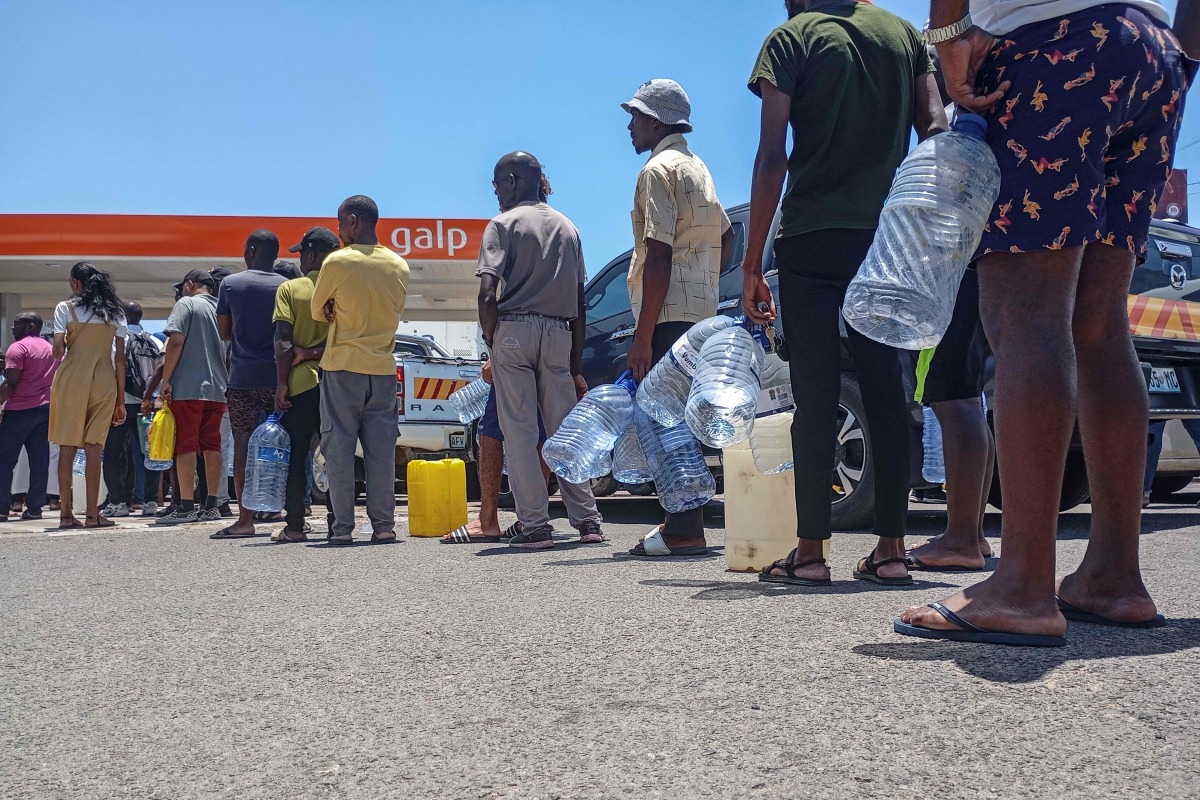 Motorists join long queues at a gas station in Maputo on December 27, 2024. (Photo by Amilton Neves / AFP)
