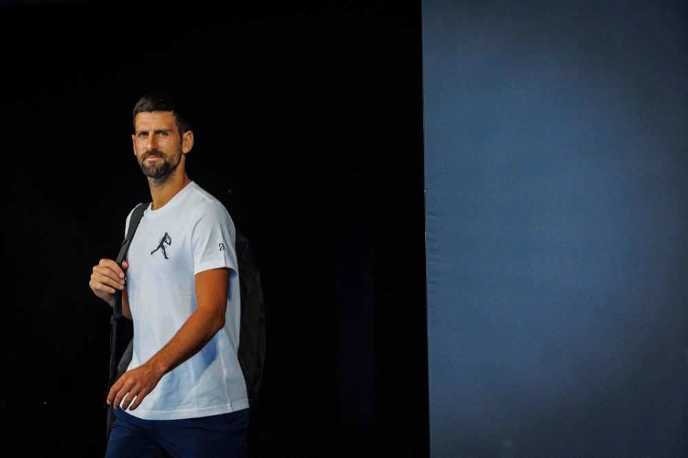 Serbian Novak Djokovic arrives to attend a training session before the Brisbane International tennis tournament in Brisbane on December 28, 2024. (Photo by Patrick Hamilton / AFP) / 