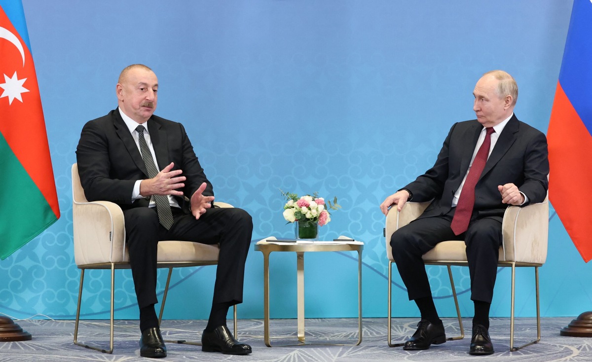 (FILES) In this pool photograph distributed by the Russian state agency Sputnik, Russia's President Vladimir Putin meets with Azerbaijani President Ilham Aliyev on the sidelines of the Shanghai Cooperation Organisation (SCO) member states leaders' summit in Astana on July 3, 2024. (Photo by Sergei SAVOSTYANOV / POOL / AFP)
