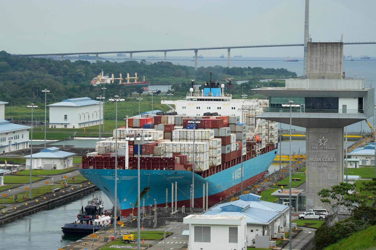 A cargo ship sails through the Agua Clara Locks of the Panama Canal in Colon City, Panama, on December 28, 2024. (Photo by ARNULFO FRANCO / AFP)
