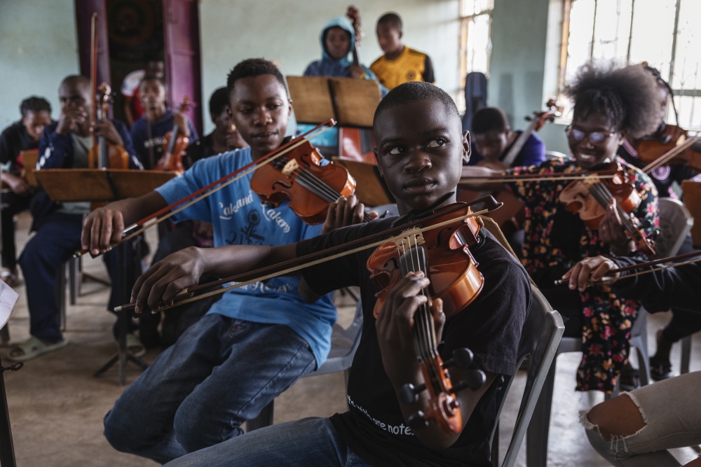 Steve Otieno rehearses with the Ghetto Classics orchestra. (Photo by Malin Fezehai for The Washington Post)