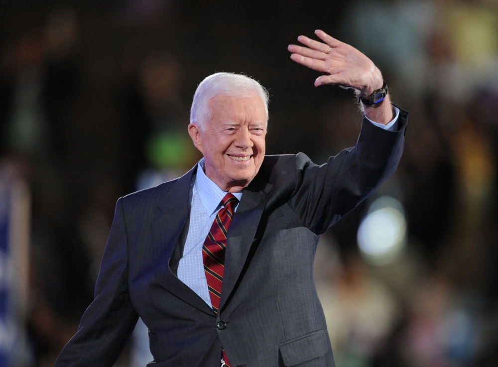 (Files) Former President Jimmy Carter waves to the crowd at the Democratic National Convention 2008 at the Pepsi Center in Denver, Colorado, on August 25, 2008. (Photo by Robyn Beck / AFP)