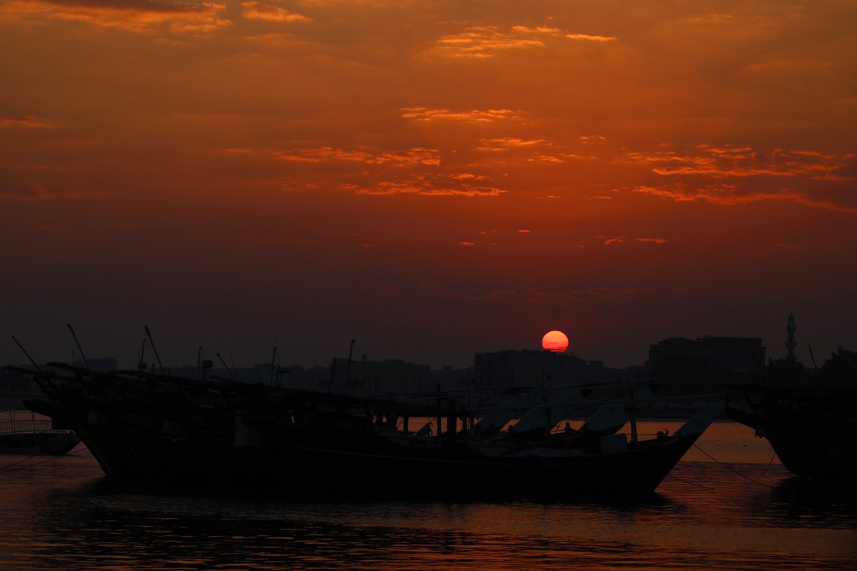 The sun sets over the marina along Al-Wakra corniche south of Qatar's capital Doha on December 25, 2024. (Photo by Karim Jaafar / AFP)
