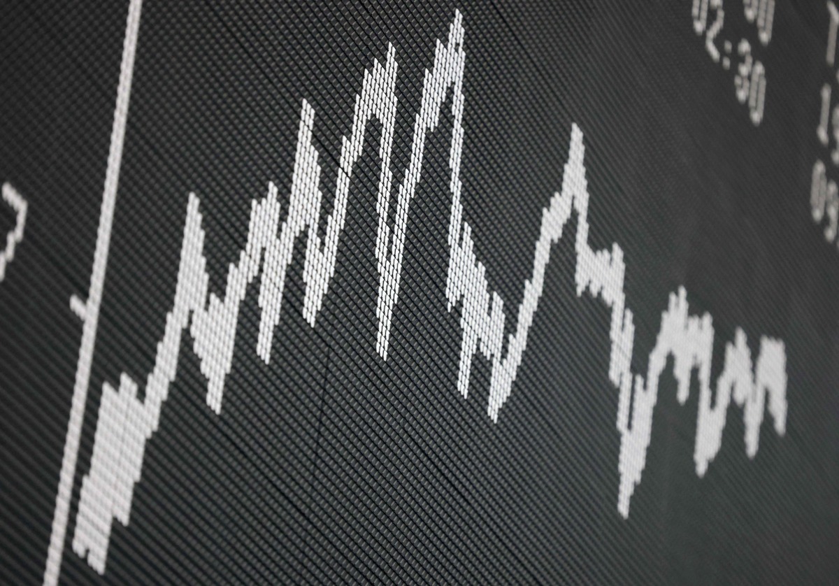 A board displays the chart of Germany's share index DAX at the stock exchange in Frankfurt am Main, western Germany, on the last day of trade of the year 2024 on December 30, 2024. (Photo by Daniel ROLAND / AFP)
