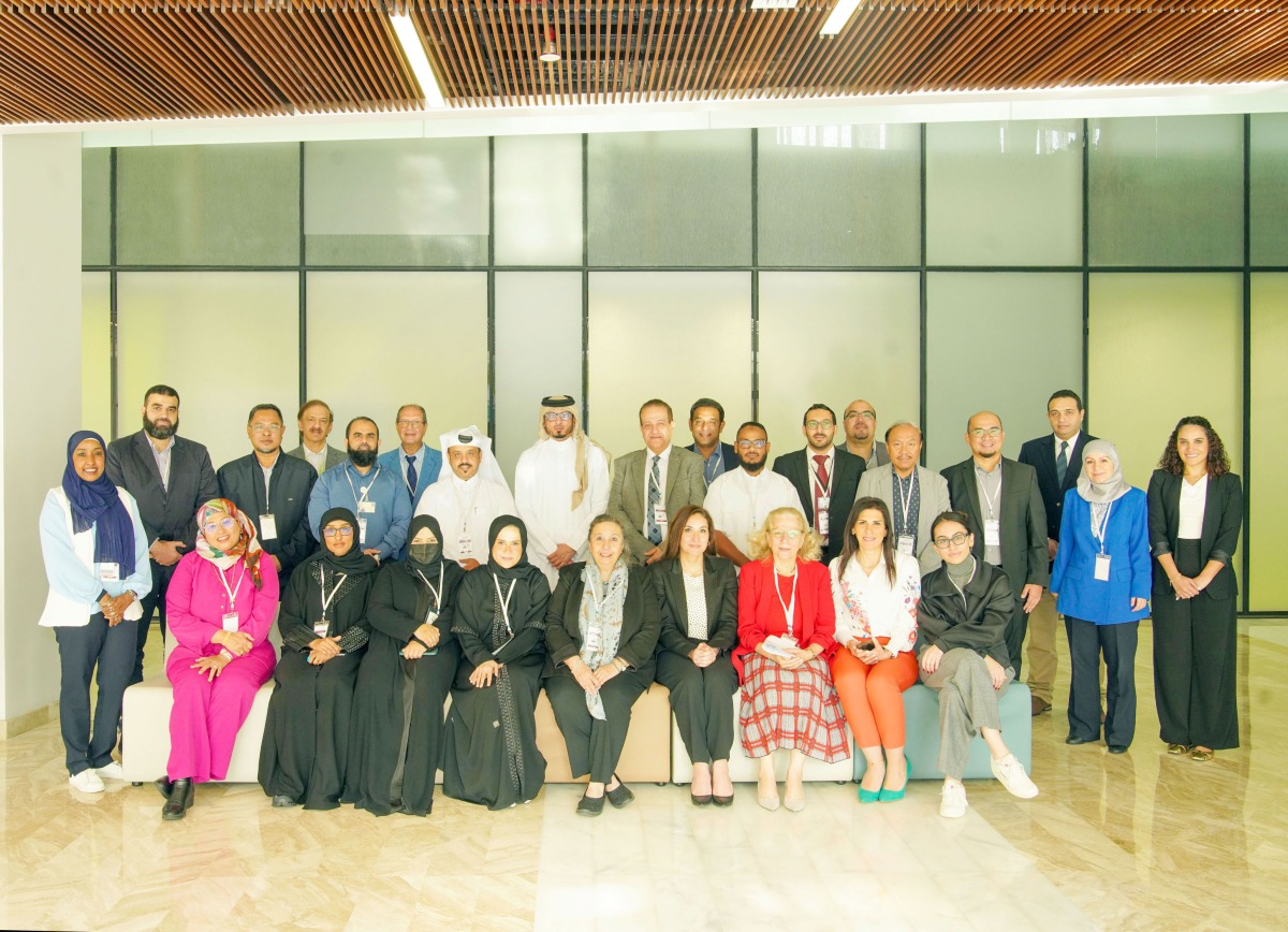 Participants and officials pose for a group photograph during the programme.