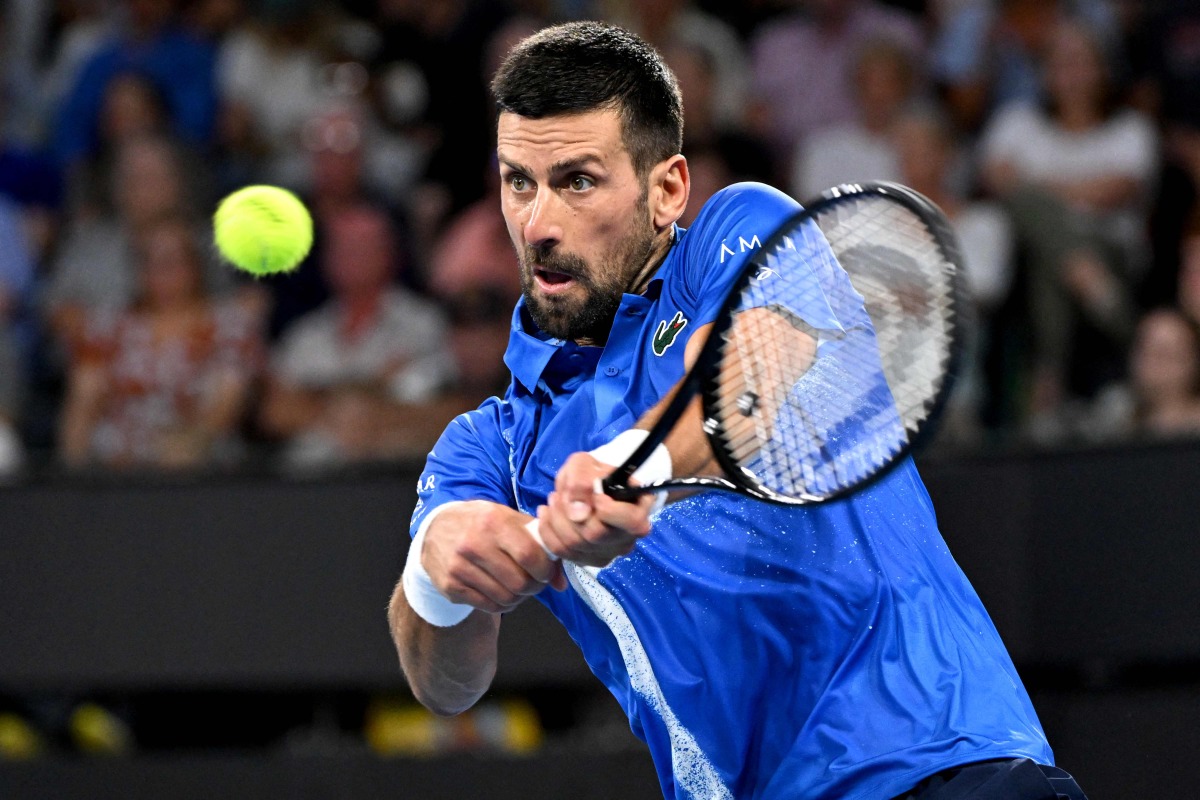 Novak Djokovic of Serbia hits a return during his men's singles match against Gael Monfils of France at the Brisbane International tennis tournament in Brisbane on January 2, 2025. (Photo by William WEST / AFP)