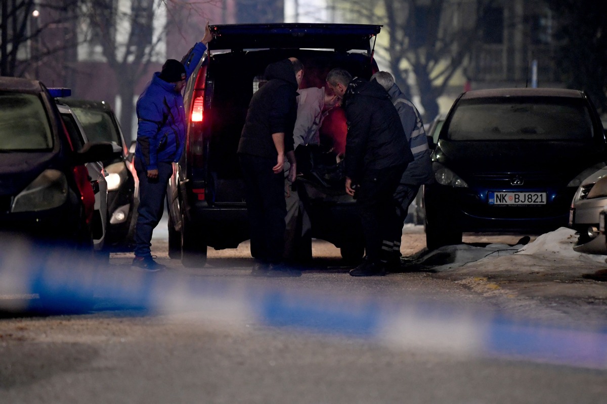 Civil defence members carry body of a victim from a crime scene after a gunman killed several people in the village of Bajice near Cetinje, on January 1, 2025. Photo by SAVO PRELEVIC / AFP