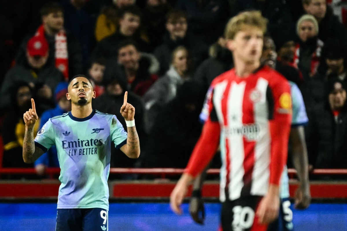 Arsenal's Brazilian striker #09 Gabriel Jesus (L) celebrates after scoring his team first goal during the English Premier League football match between Brentford and Arsenal at the Gtech Community Stadium in London on January 1, 2025. (Photo by JUSTIN TALLIS / AFP)