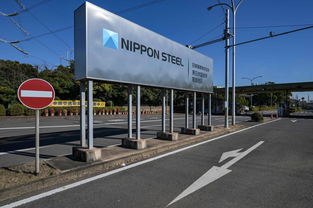 (Files) An entrance sign for Japanese company Nippon Steel's East Nippon Works Kashima Area facility is pictured in Kashima, Ibaraki prefecture, north of Tokyo on December 6, 2024. (Photo by Richard A. Brooks / AFP)