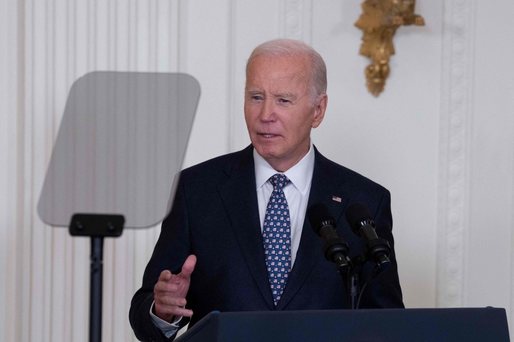 US President Joe Biden delivers remarks at a Medal of Honor Ceremony in the East Room of the White House in Washington, DC, on January 3, 2025. (Photo by Chris Kleponis / AFP)