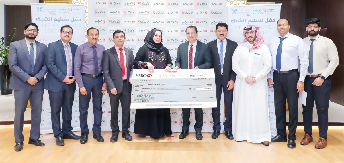 Luly Hypermarket and Qatar Cancer Society officials during the cheque handover ceremony.