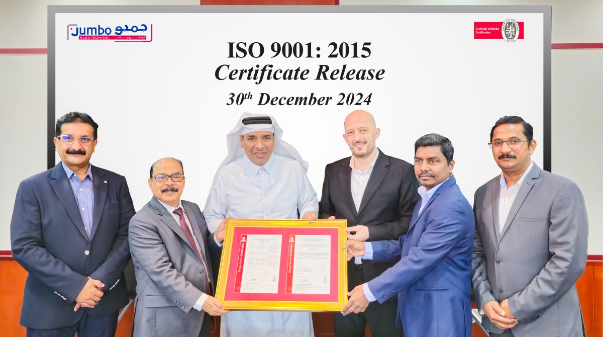 Vice Chairman and Managing Director of Jumbo Electronics, Sajed Jassim Mohammed Sulaiman; and the Director & CEO of Jumbo Electronics, C V Rappai, along with other officials receiving the ISO re-certification.