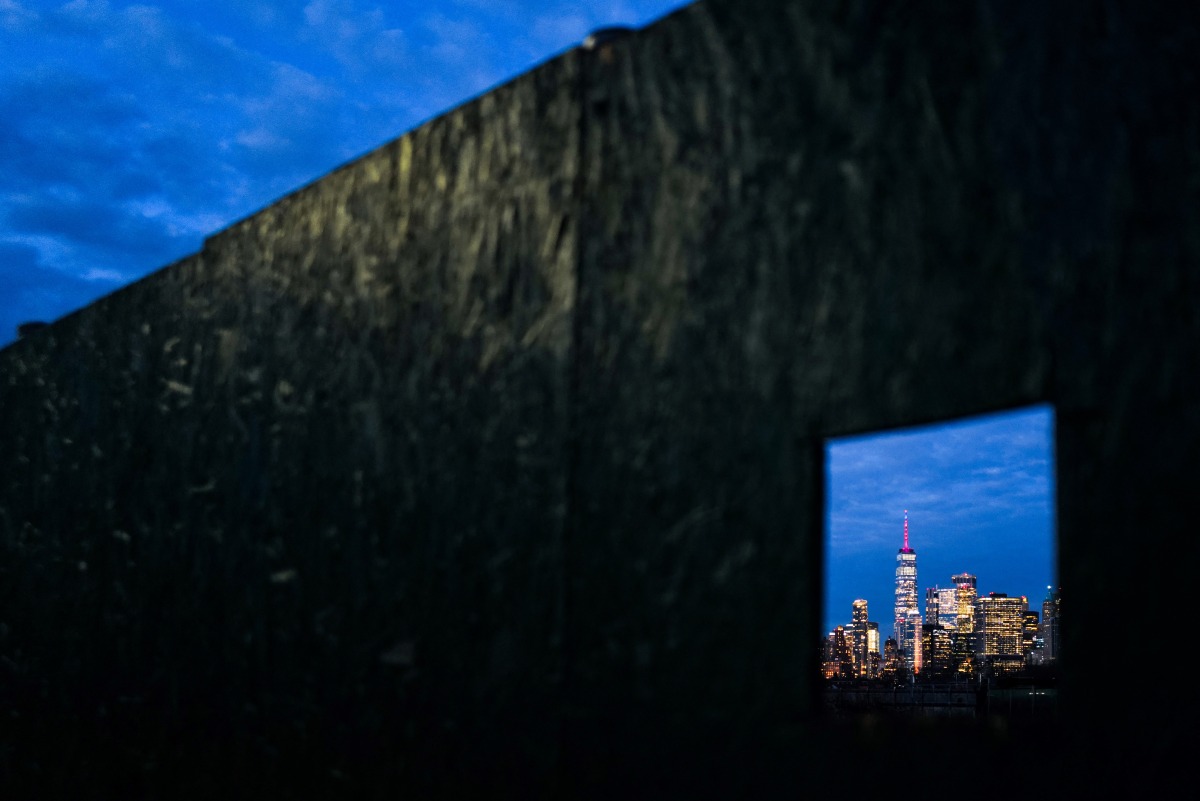 One World Trade Center (C), also known as the Freedom Tower, stands out on the Manhattan skyline on December 31, 2024 in New York. (Photo by CHARLY TRIBALLEAU / AFP)
