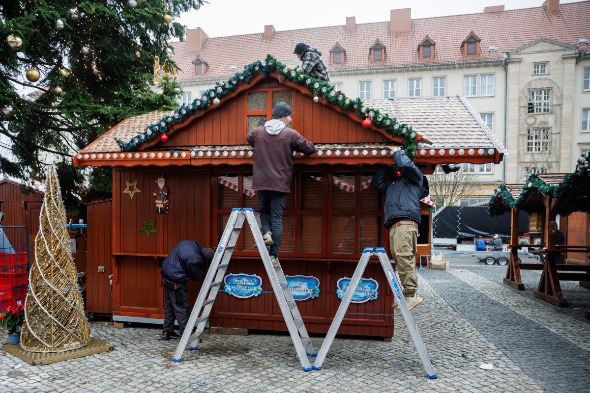 Employees begin to dismantle the closed Christmas market shops at the site of a car-ramming attack on a Christmas market in Magdeburg, eastern Germany, on December 27, 2024. Photo by JENS SCHLUETER / AFP