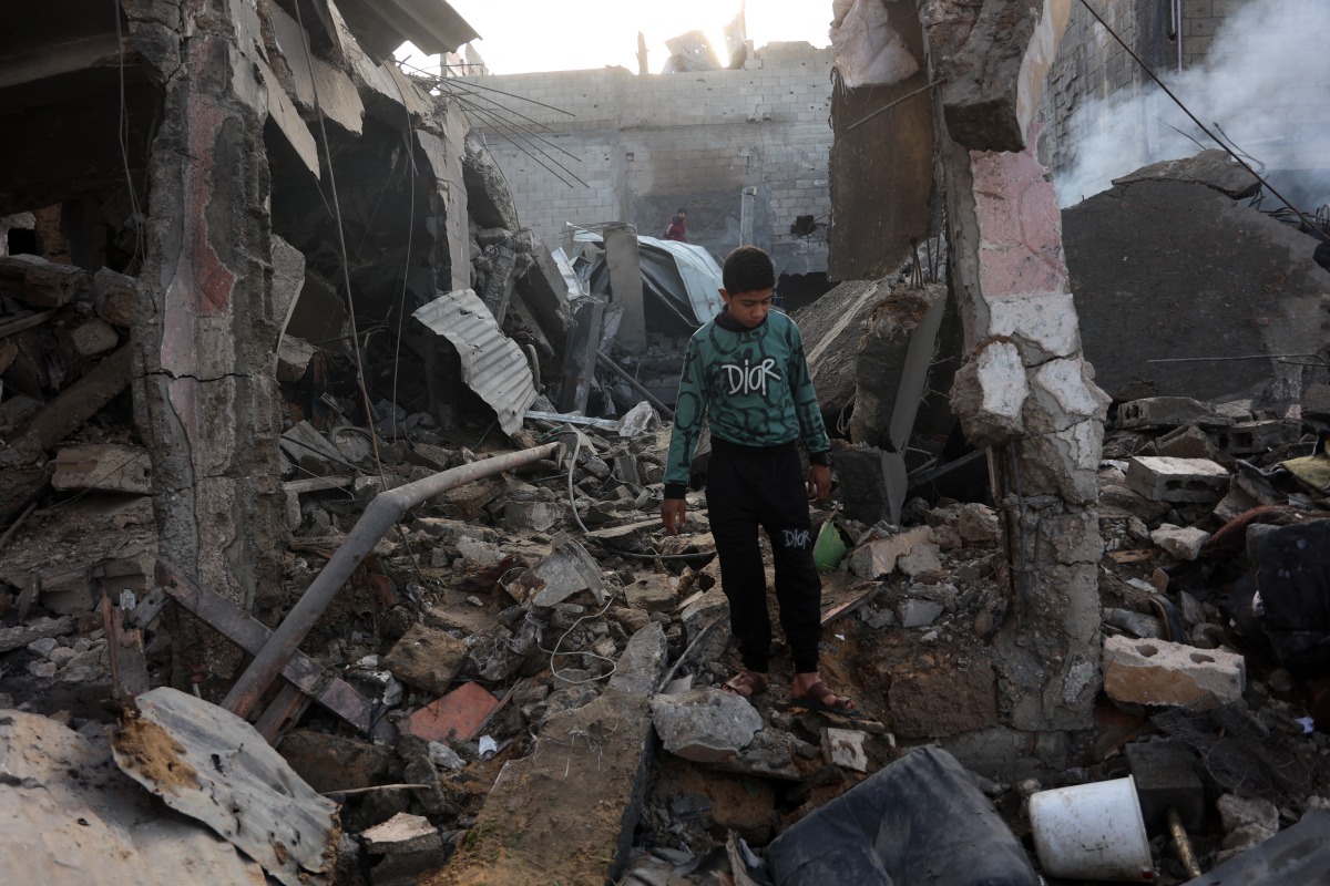  A Palestinian boy walks amid the destruction following an Israeli strike that hit the home of the Ghoula family in the Shujaiya neighbourhood of Gaza City, in the northern Gaza Strip on January 4, 2025. Photo by Omar AL-QATTAA / AFP