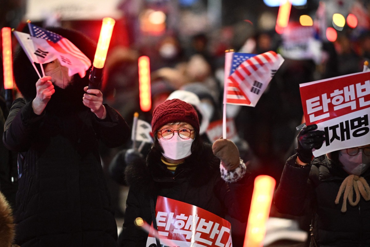 Supporters of impeached South Korea president Yoon Suk Yeol take part in a rally near his residence in Seoul on January 7, 2025. Photo by Philip FONG / AFP