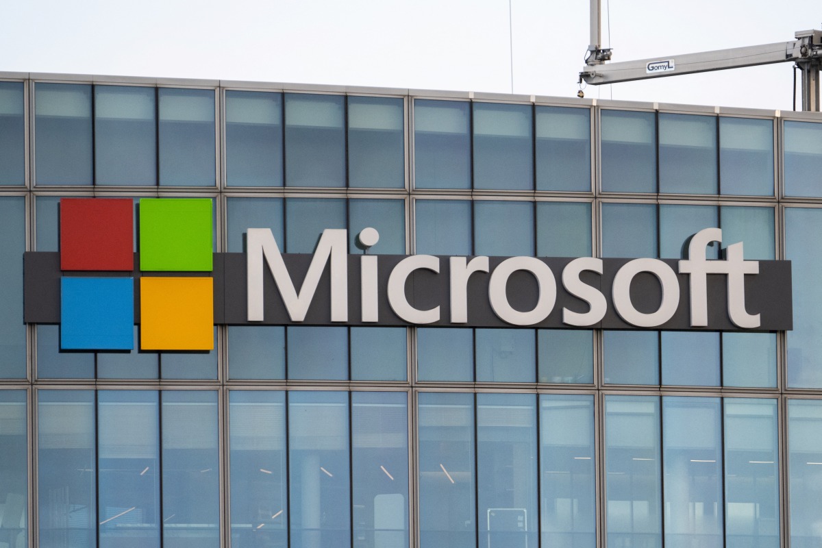 This photograph shows a view of Microsoft's logo on the company's French headquarters in Issy-les-Moulineaux on the outskirts of Paris on January 6, 2025. (Photo by Martin LELIEVRE / AFP)