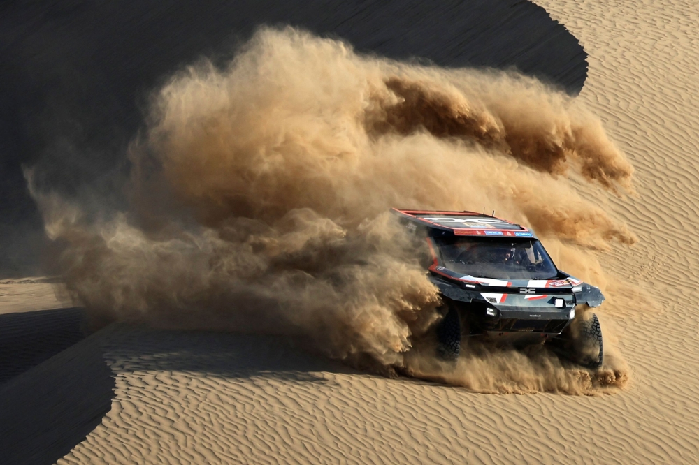 Qatari driver Nasser Al Attiyah steers his car assisted by his co-driver Edouard Boulanger during stage 2B of the 47th Dakar Rally between Bisha and Bisha, on January 6, 2025. (Photo by Valery Hache / AFP)