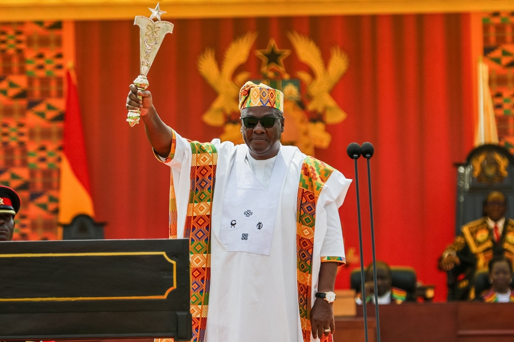 Ghana's new President John Mahama holds state sword after taking the oath of office at his inauguration at the Independence Square in Accra on January 7, 2025. (Photo by Nipah Dennis / AFP)