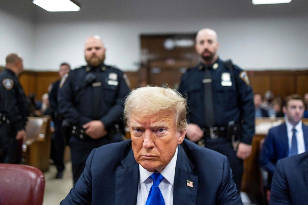 (FILES) Former US President Donald Trump sits at the defendant's table inside the courthouse as the jury is scheduled to continue deliberations for his hush money trial at Manhattan Criminal Court on May 30, 2024 in New York City. (Photo by Justin LANE / POOL / AFP)
