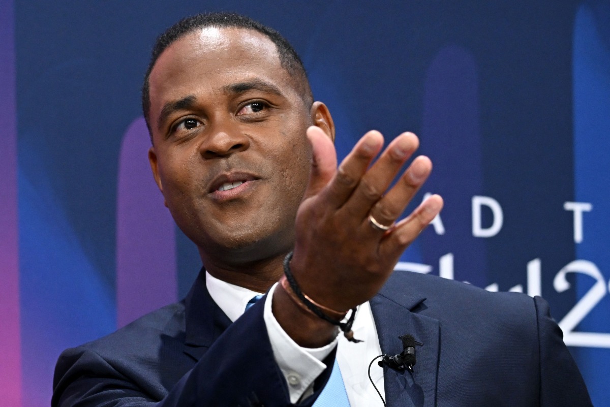 (FILES) UEFA Champions League final ambassador and former Dutch footballer Patrick Kluivert attends a ceremony of the draw for the quarter-final, semi-final and final of the 2022-2023 UEFA Champions League football tournament, in Nyon, on March 17, 2023. (Photo by Fabrice COFFRINI / AFP)
