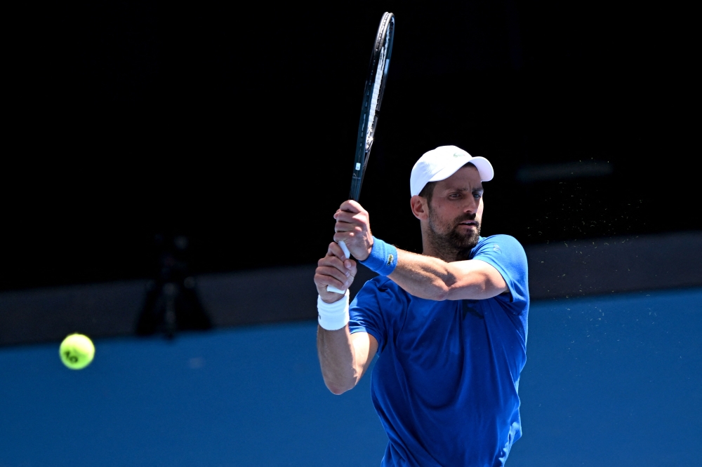 Serbia's Novak Djokovic hits a return during a training session ahead of the Australian Open tennis tournament in Melbourne on January 9, 2025. (Photo by William West / AFP) 