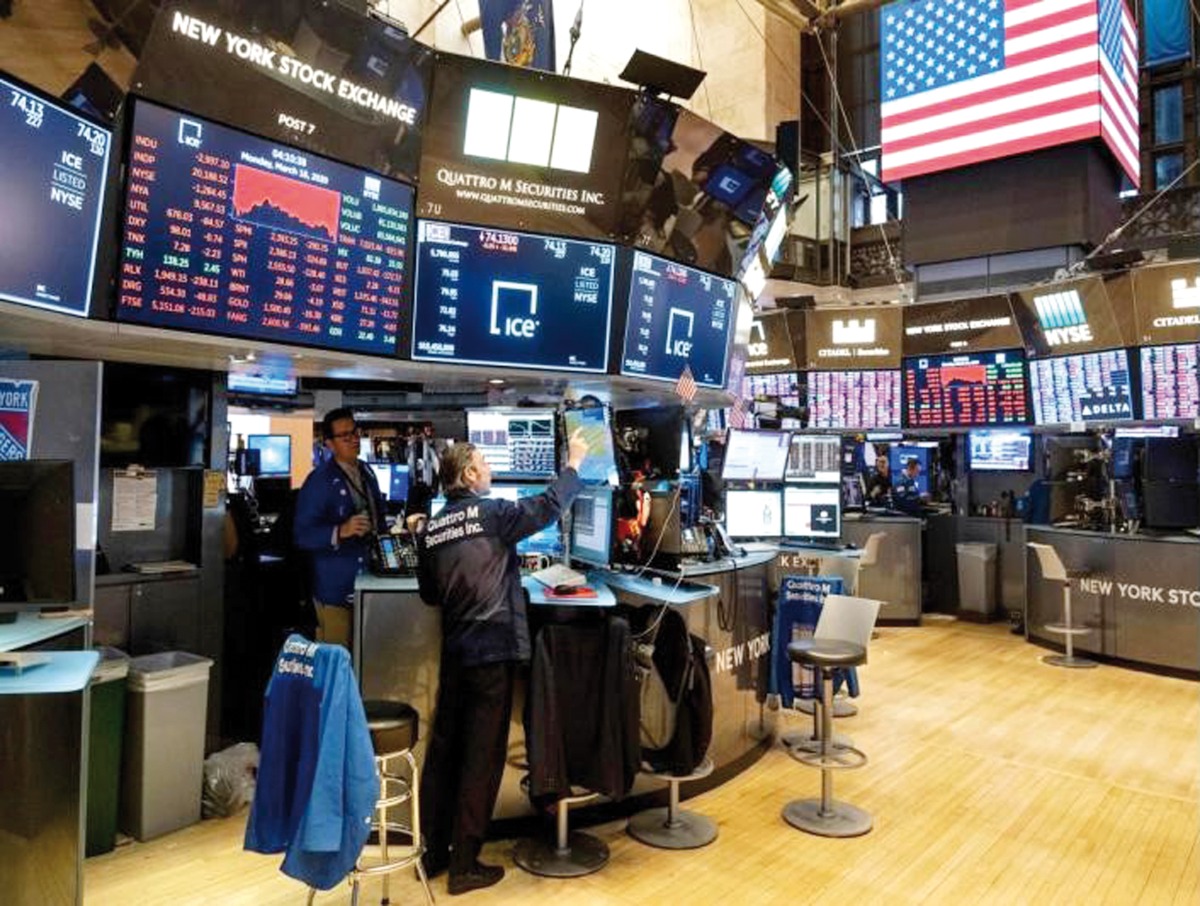 A file photo of traders working at the New York Stock Exchange in New York, US.