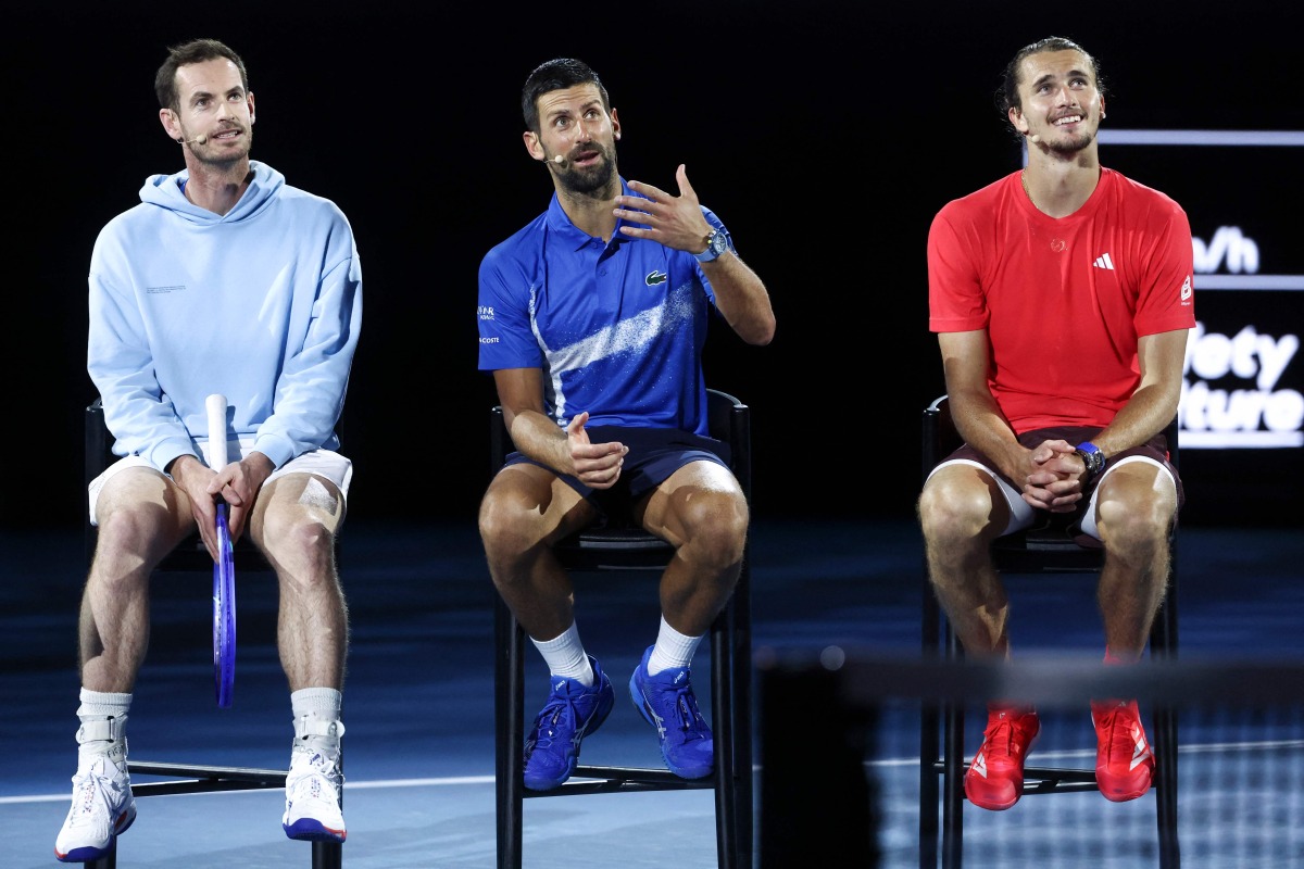 :Britain’s Andy Murray (L) reacts with Serbia’s Novak Djokovic (C) and Germany’s Alexander Zverev during a charity event titled ‘Night with Novak’ on Rod Laver Arena in Melbourne on January 9, 2025 ahead of the Australian Open tennis championship starting on January 12. (Photo by DAVID GRAY / AFP)