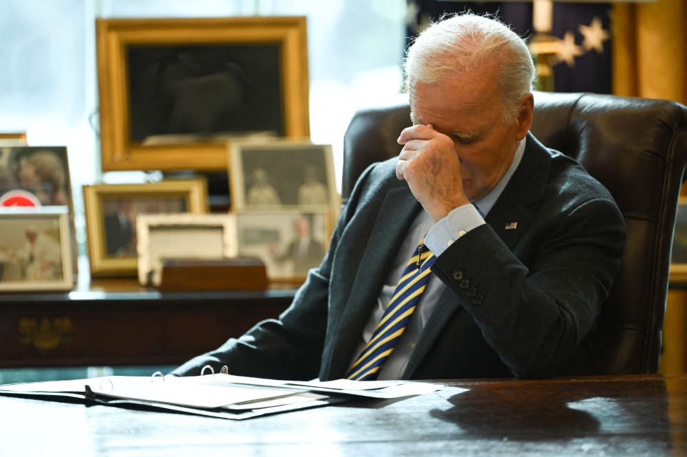 US President Joe Biden listens during a briefing on the federal response to the Los Angeles wildfires in the Oval Office of the White House in Washington, DC, on January 10, 2025. (Photo by Andrew Caballero-Reynolds / AFP)