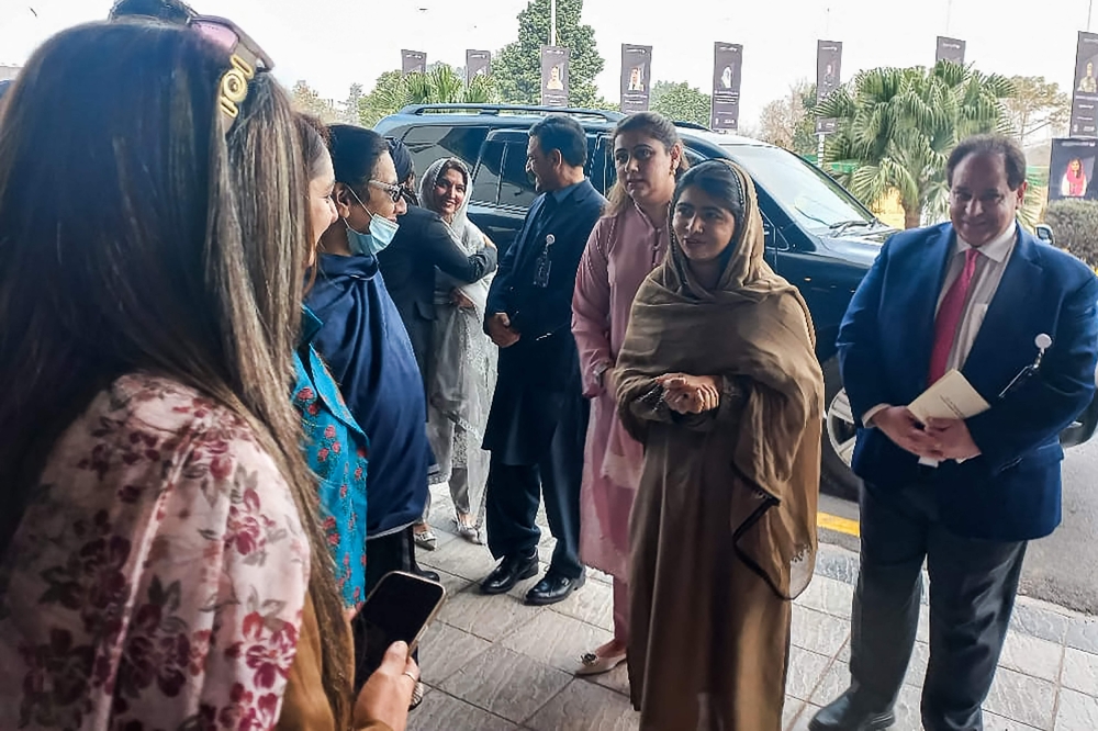 Nobel Peace Prize Laureate Malala Yousafzai (2R) arrives to attend an international summit on 'Girls’ Education in Muslim Communities', in Islamabad on January 11, 2025. (Photo by Zain Zaman Janjua / AFP)