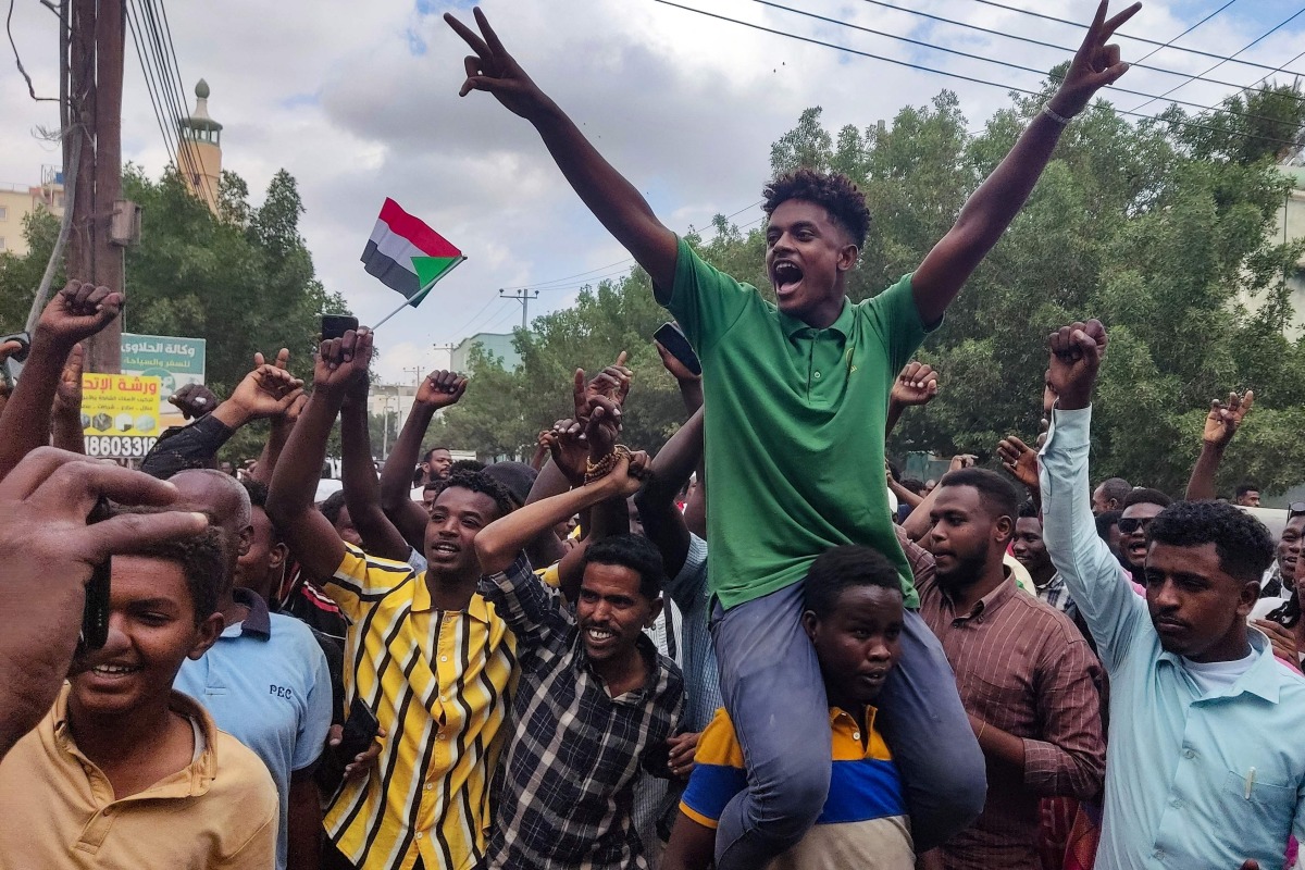 People take to the streets of Port Sudan to celebrate the reported advance of Sudanese military forces and allied armed groups on the key Al-Jazira state capital Wad Madani, held by the paramilitary Rapid Support Forces (RSF), on January 11, 2025. (Photo by AFP)
