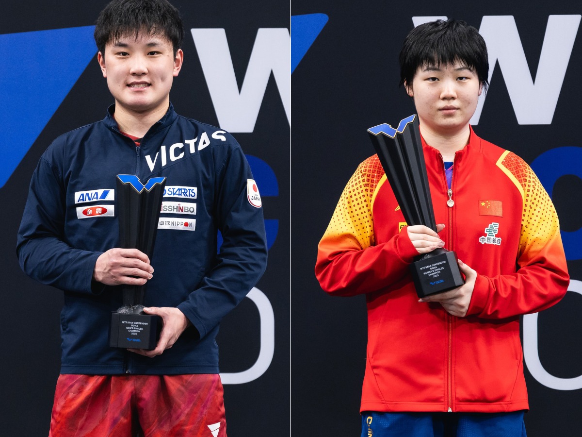 Tomokazu Harimoto (left) and Kuai Man celebrate with their trophies. 