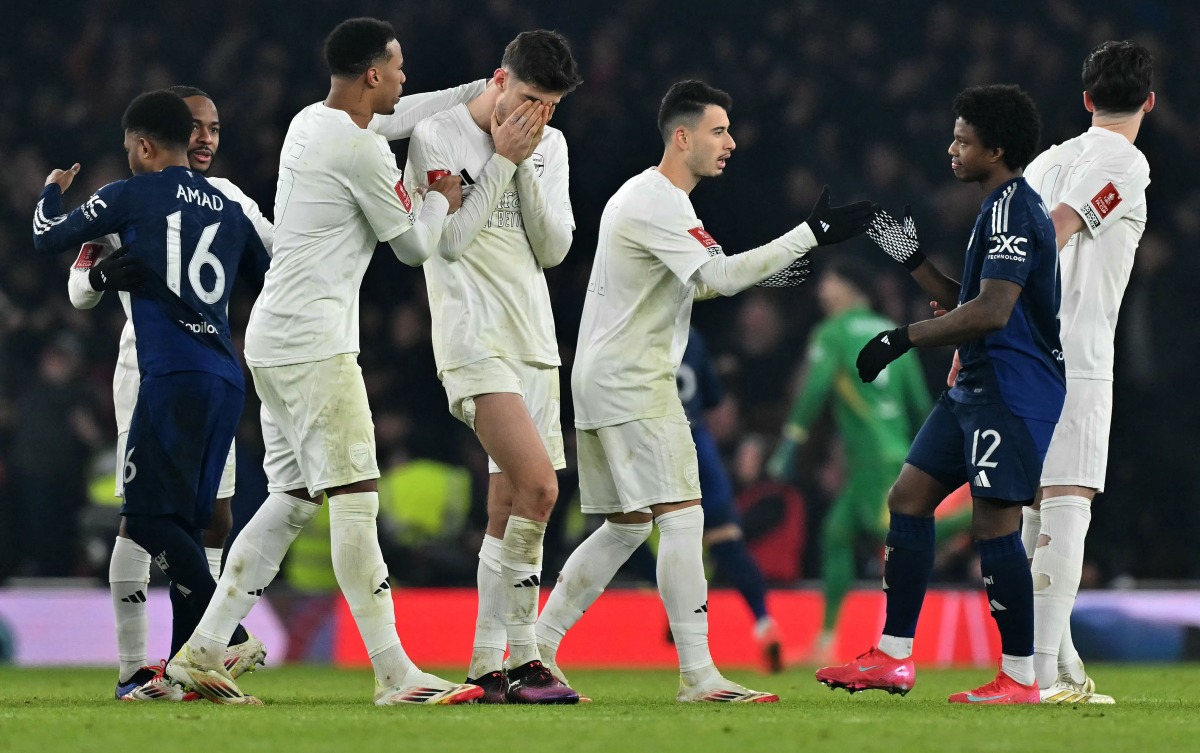 Arsenal's German midfielder #29 Kai Havertz (C) reacts after Arsenal lost during a peanlty shoot out, the English FA Cup third round football match between Arsenal and Manchester United at the Emirates Stadium in London on January 12, 2025. (Photo by Glyn KIRK / AFP)