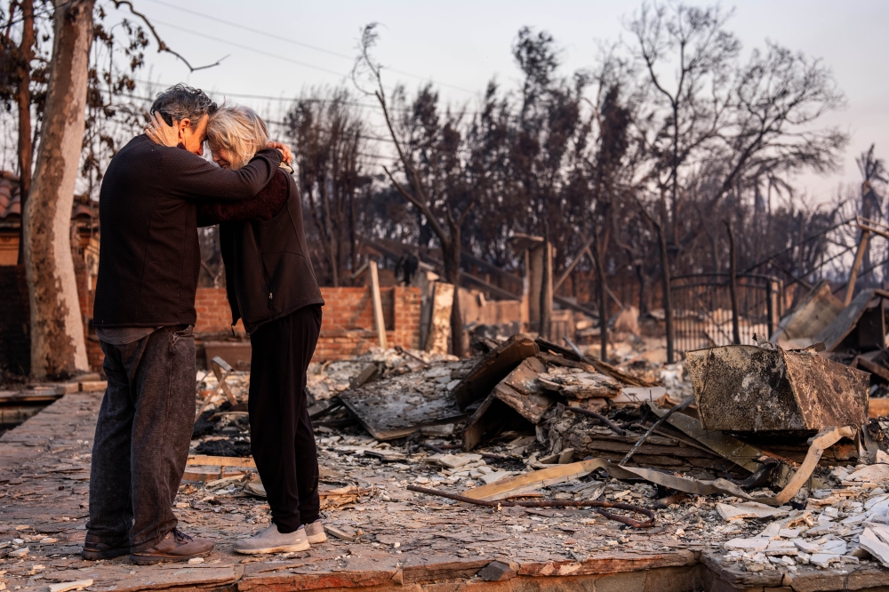 Actress Gail Matthius Wirth and writer John Wirth, showrunner and executive producer for 'Dark Winds', see their burnt home for the first time, in Pacific Palisades, California, on Thursday. (Photo by Melina Mara/The Washington Post)