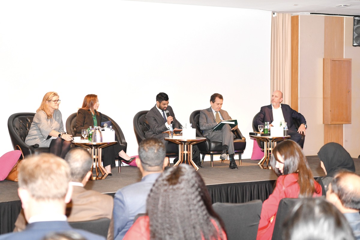 Industry leaders exchanging ideas during a panel discussion.