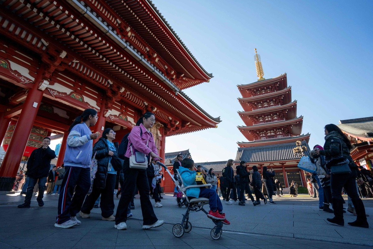 Tourists visit Sensoji Temple in Asakusa, Tokyo on January 14, 2025. Photo by Kazuhiro NOGI / AFP