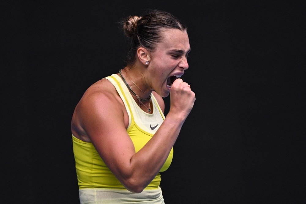 Belarus' Aryna Sabalenka reacts after a point against Spain's Jessica Bouzas Maneiro during their women's singles match on day four of the Australian Open tennis tournament in Melbourne on January 15, 2025. (Photo by William West / AFP) 