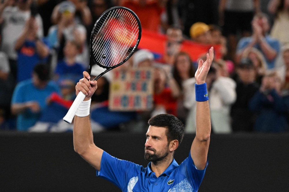 Serbia's Novak Djokovic celebrates after victory against Portugal's Jaime Faria during their men's singles match on day four of the Australian Open tennis tournament in Melbourne on January 15, 2025. (Photo by William West / AFP) /